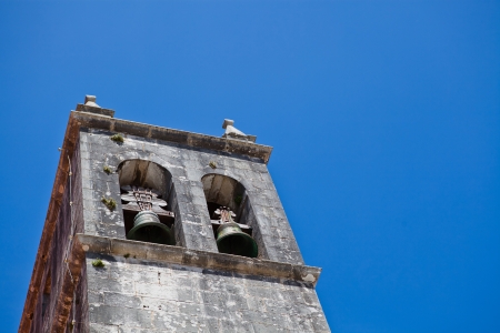 Belltower of Igreja de Santa Maria do Castelo or Church of Santa Maria in Lourinha in Lisbon district of Portugalの写真素材