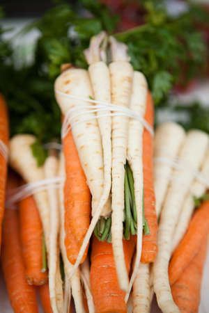 Closeup of fresh carrots on sale at produce marketの写真素材