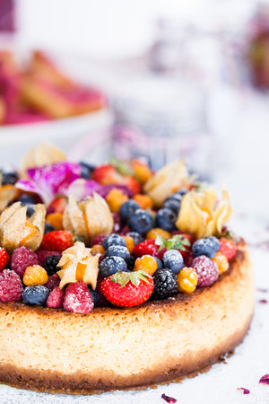 Closeup of delicious sponge cake topped with fresh berriesの写真素材