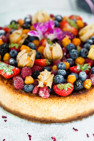 Closeup of delicious sponge cake topped with fresh berriesの写真素材