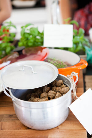 Closeup of pot of freshly prepared meat balls on table ready to serve at dinner partyの写真素材