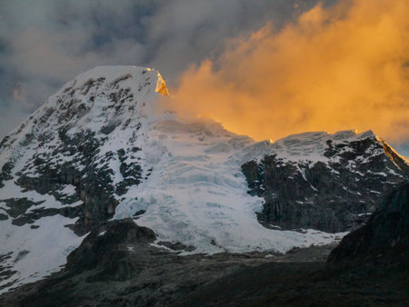cordillera blanca trail huayhuash, mountain top by sunset getting red.の写真素材