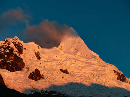 cordillera blanca trail huayhuash, mountain top by sunset getting red.の写真素材