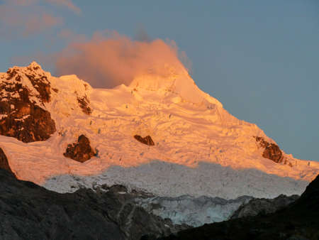 cordillera blanca trail huayhuash, mountain top by sunset getting red.の写真素材