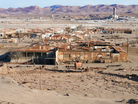 Derelict and rusting accommodation village at the historic Humberstone Saltpeter Works in the Atacama Desert near Iquique in Chile. The site is now an open air museum and a Unesco World Heritage SIteのeditorial素材