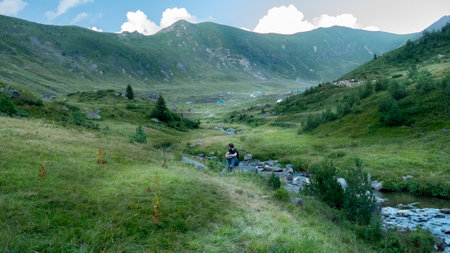mountain view of the peaks of the Balkan. high mountains, blue skys. person in the middleの写真素材