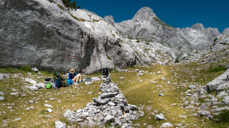 mountain view of the peaks of the Balkan. high mountains, blue skys. person in the middleの写真素材