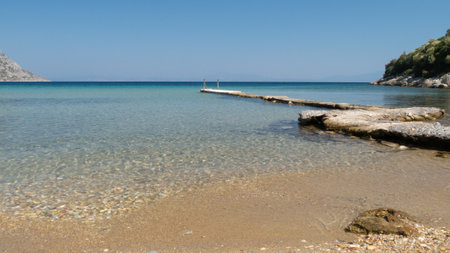 beach with stones and blue seaの写真素材