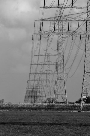 Power pole. cables or wires are connected between each concrete electricity post. beautiful sky and cloud background.の写真素材