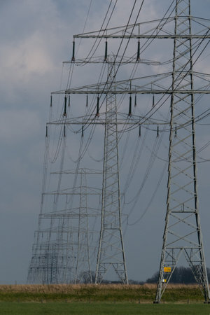 Power pole. cables or wires are connected between each concrete electricity post. beautiful sky and cloud background.の写真素材
