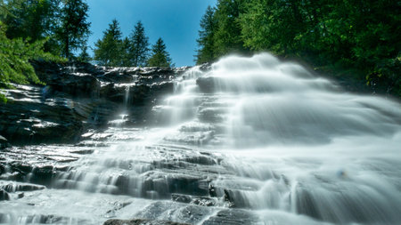 france Waterfall with long exposure and blurred water flow in Ecrins national parkの写真素材