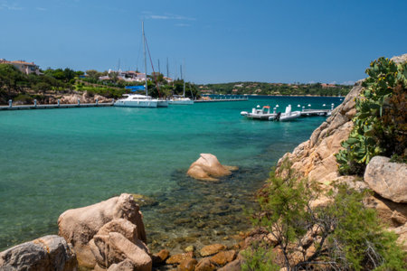Clear amazing azure colored sea water with granite rocks in Capriccioli beach, Sardinia, Italy.の写真素材