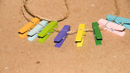 Colorful wooden clothespin. Background of colorful clothes pegs. Closeup of colorful clothespins.の写真素材