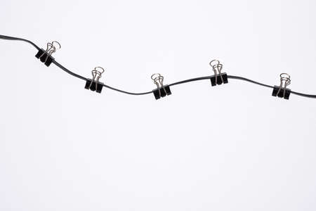 office paper clips on rope isolated on whiteの写真素材