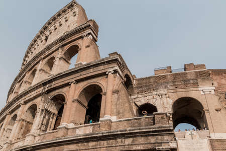 bottom and close view of coliseum, tourists look out onto the terraces.の写真素材
