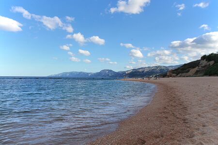 Spiaggia della Sardegna. Sardinia, blue sky, people in the distanceの写真素材