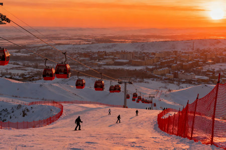 Ski resort in the mountains at sunset. Beautiful winter landscape.の素材