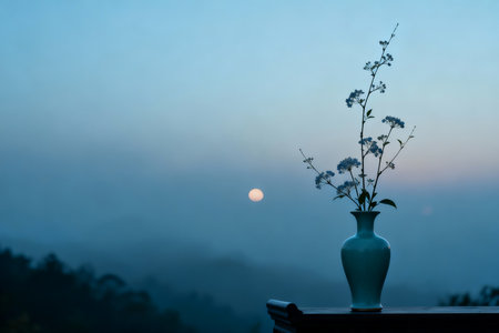 Vase with flowers on the balcony in the morning with the moon in the backgroundの素材