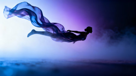 Silhouette of a woman dancing in the dark with smoke and fogの素材