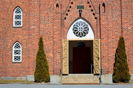 Church doors are open in the sunlightの写真素材
