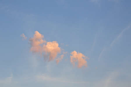 Small clouds in the sky getting red in sun set