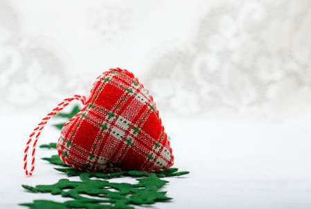 Decorative red textile heart with white background
