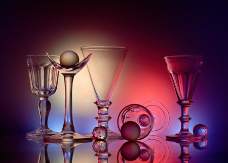 An arrangement of goblets in different size and shape and colorful background