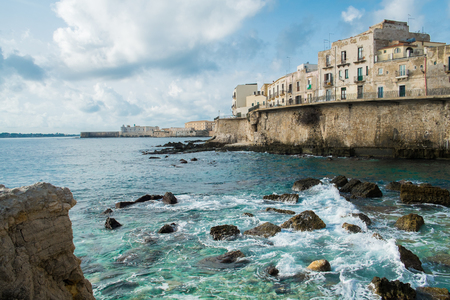 Syracuse Ortigia seafront and fortified wall, Sicily, Italyの写真素材