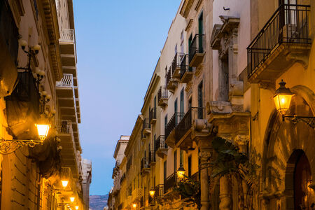 Downtown road at night in Trapani, Sicily, Italyの写真素材