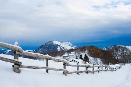 Houses on Alps montains in winter on the way to Grigna, Lecco, Italyの写真素材