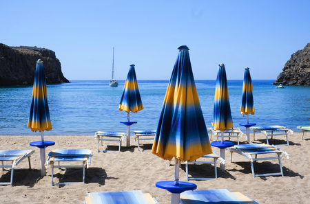 Umbrellas on Cala Domestica beach in summer, Sardinia, Italyの写真素材