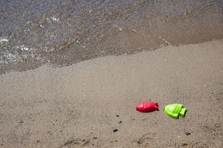 Plastic fishes on the seaside in a beach in Sardinia on the seaside in a beach in Sardiniaの写真素材