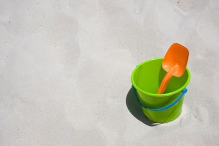 Bucket and shovel on a sandy beachの写真素材