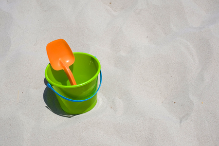 Bucket and shovel on a sandy beachの写真素材