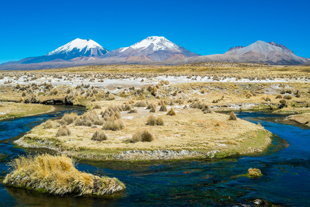 Twin volcanos Parinacota and Pomerape in Sajama National Park, Boliviaの写真素材