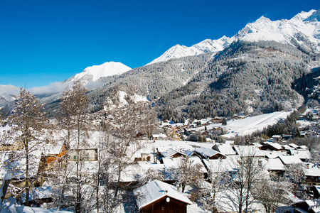 View of Mont Blanc and Les Contamines village in Winter, Chamonix, Franceの写真素材