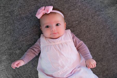 Baby girl four month old with pink bow