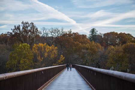 Couple walking on a bridgeの写真素材