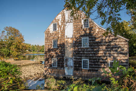 Abandoned wooden house on the shore of a lake in New Jerseyの写真素材