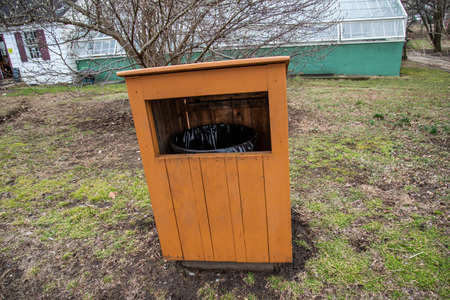 Wooden trash can in the yard of a residential house. High quality photoの写真素材