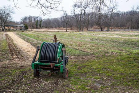 A green irrigation machine on the field.の写真素材