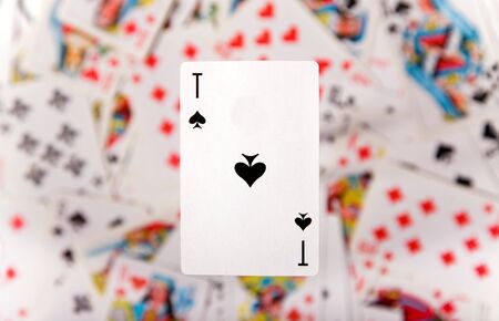 Close-up up of an ace over blurred card background の写真素材