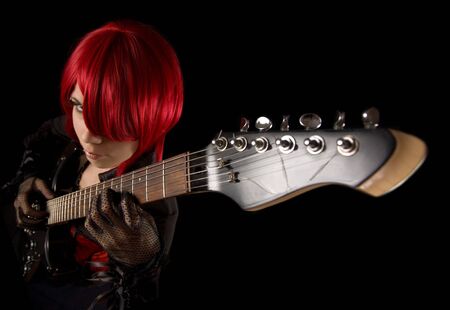 Attractive girl with guitar, selective focus on fingers, high angle view の写真素材