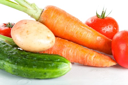 Close-up shot of fresh wet vegetables, isolated on white background の写真素材