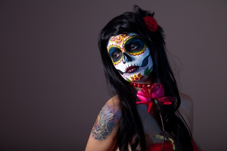 Sugar skull girl with red rose, professional body-art の写真素材