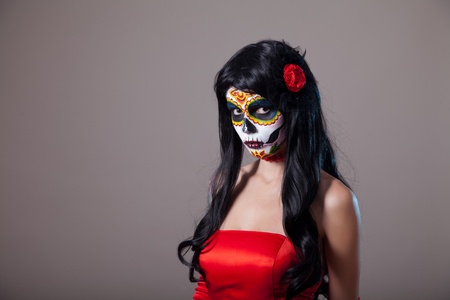 Sugar skull girl in red dress, studio shot の写真素材