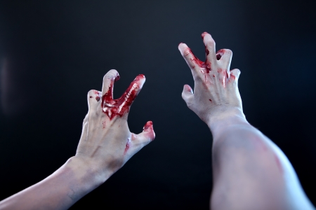 Zombie stretching bloody hands, first person point of view の写真素材