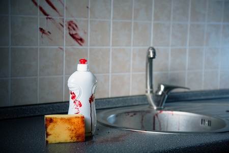 Bottle of dishwashing liquid, sponge and tile with bloody fingerprints, Halloween or criminal concept の写真素材