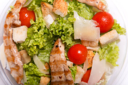 Delicious Caesar salad with grilled chicken meat, top viewの写真素材
