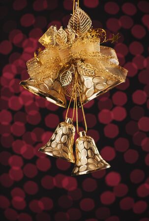 Beautiful Christmas bells decoration over holiday bokeh background
